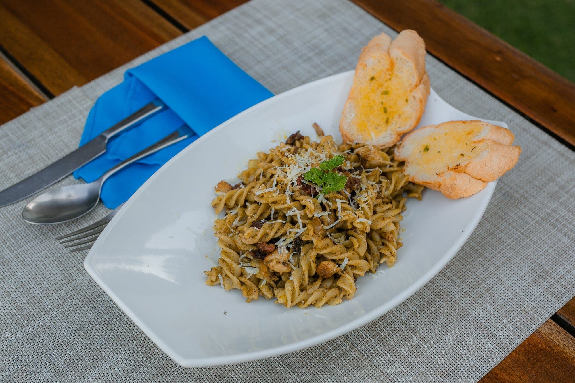 Pesto pasta with parmesan and garlic bread